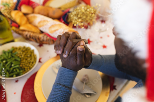 Multigeneration family having christmas dinner together