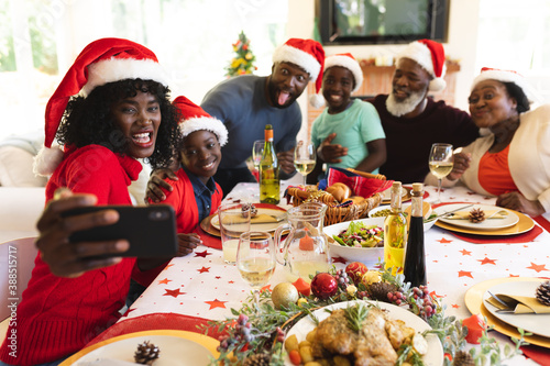 Multigeneration family having christmas dinner together