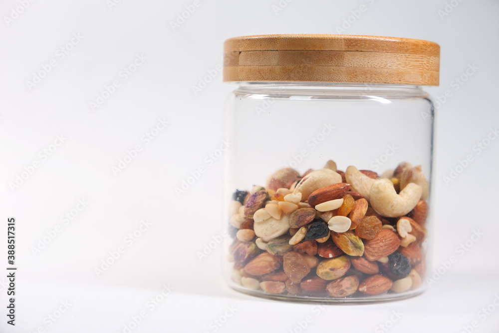 a jar of mixed nut isolated on white background a jar of mixed nut isolated on white background