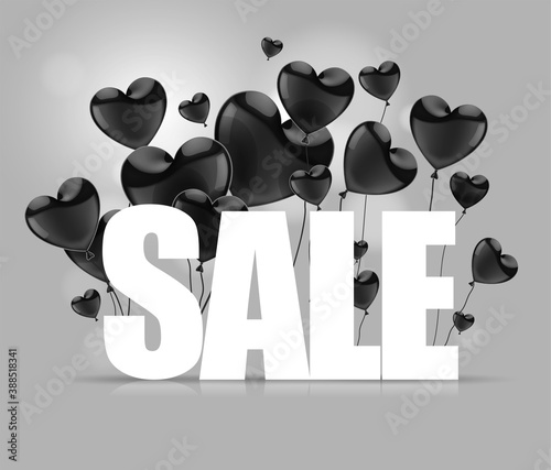 White SALE word with  black glossy  balloons in the shape of a heart.