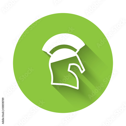White Greek helmet icon isolated with long shadow. Antiques helmet for head protection soldiers with a crest of feathers or horsehair. Green circle button. Vector.