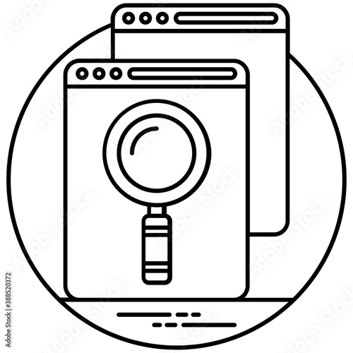
A magnifying glass on a computer screen depicting browsing 
