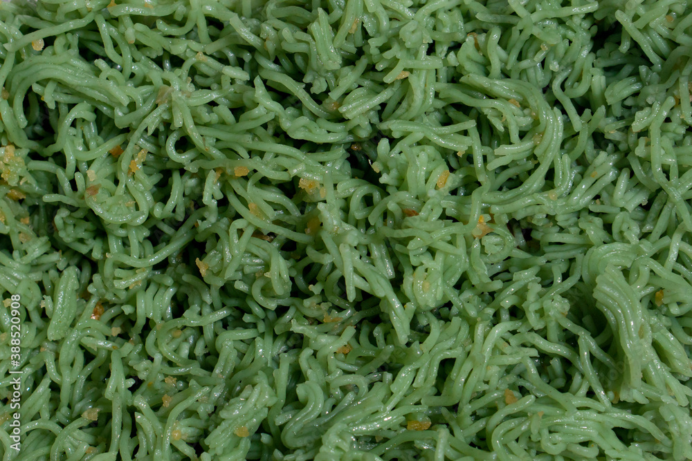 Top view of green noodle or jade vermicelli mix with fried Garlic. for food background. Top view of green noodle or jade vermicelli mix with fried Garlic. for food background.