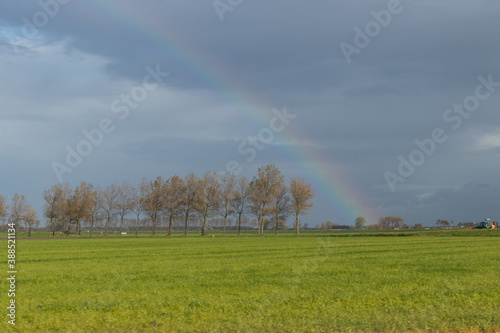 Rainbow in a flatland landscape in the autumn