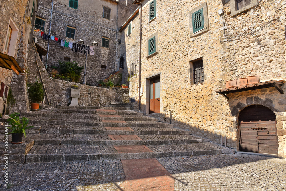 A small road crosses the old buildings of Prossed, a medieval village in the Lazio region, Italy. A small road crosses the old buildings of Prossed, a medieval village in the Lazio region, Italy.