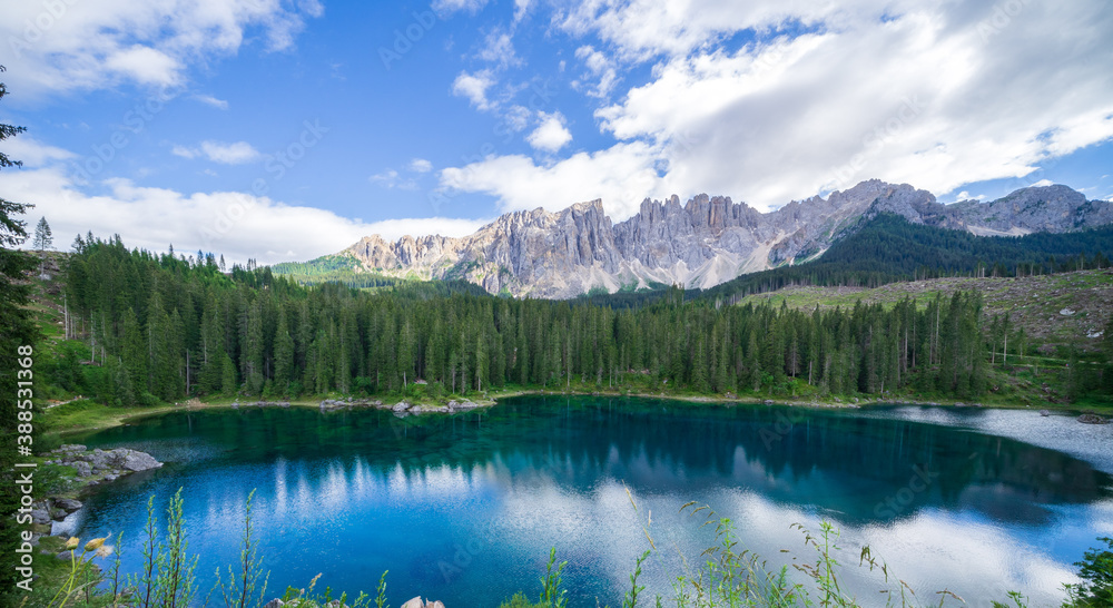 Panorama of Carezza lake, Dolomites Alps. South Tyrol. Italy
