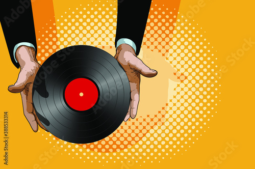 Male hands gently hold a retro vinyl record with a red label in the center