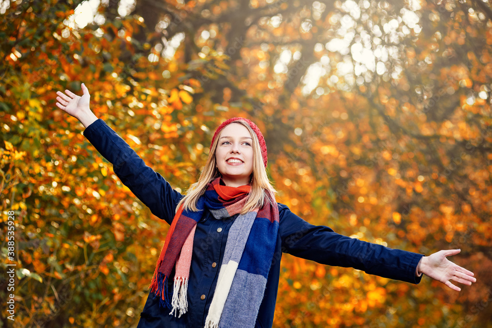 Blonde happy girl in good mood posing in autumn park Blonde happy girl in good mood posing in autumn park