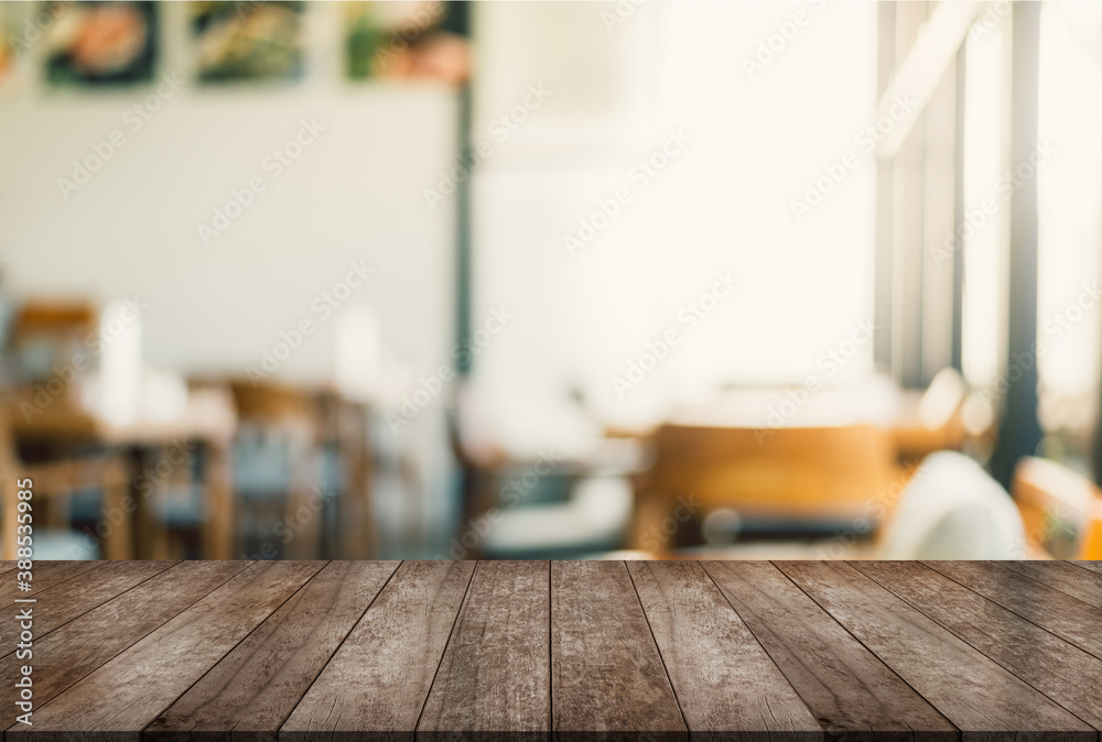 Empty wood table on blur restaurant background. Empty wood table on blur restaurant background.