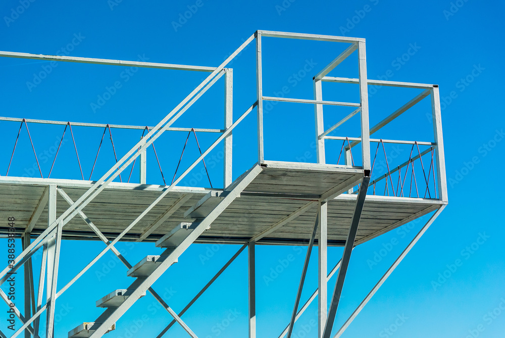 Old observation tower against the clear blue sky