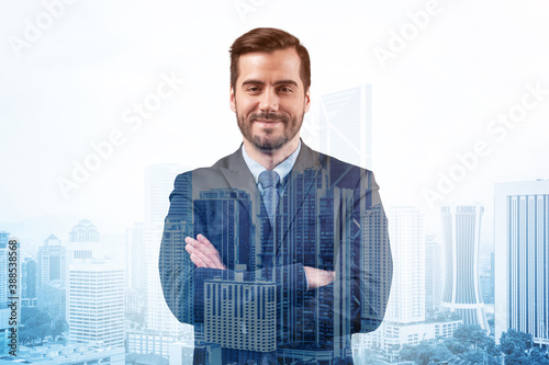 Prosperous European entrepreneur in suit in crossed arms pose. Kuala Lumpur cityscape. The concept of problem solving. KL skyscrapers. Double exposure.