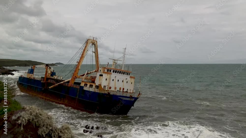 Motion Time Lapse of an abandoned Ghost Ship stranded on a rocky Coast. Abandoned Shipwreck Motion Time Lapse of an abandoned Ghost Ship stranded on a rocky Coast. Abandoned Shipwreck