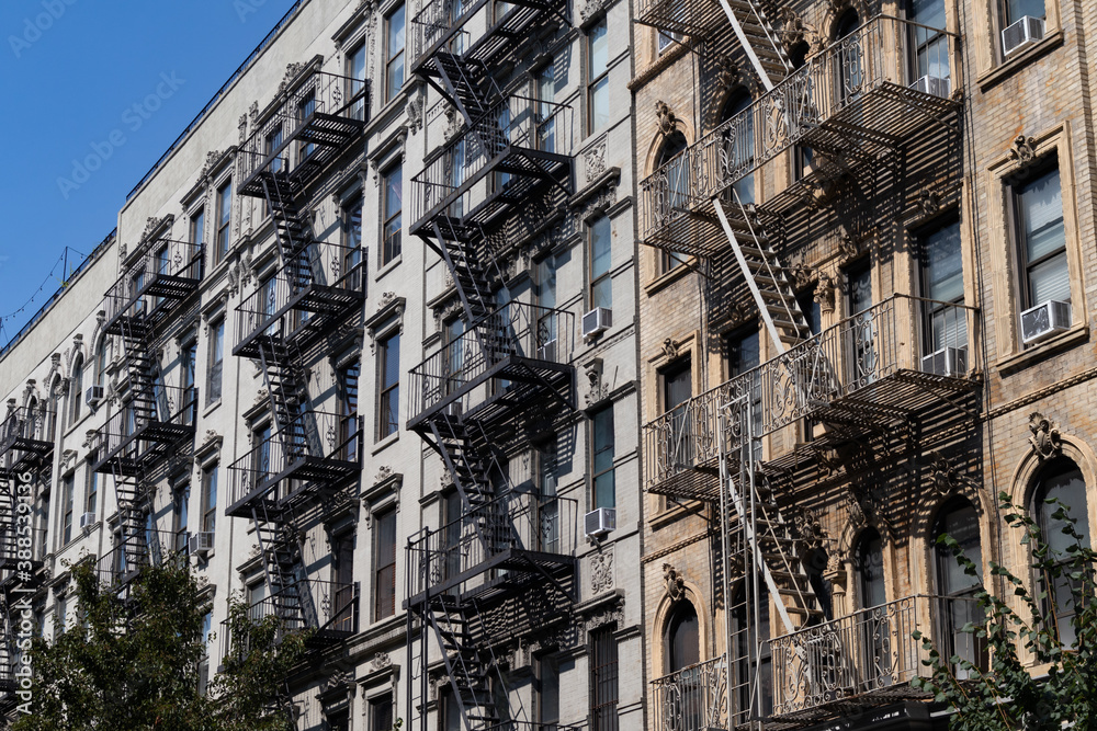 Row of Old Apartment Buildings in the East Village of New York City with Fire Escapes