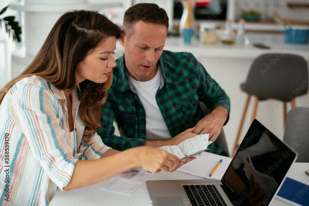 Husband and wife preparing bills to pay. Young couple having financial problems Husband and wife preparing bills to pay. Young couple having financial problems