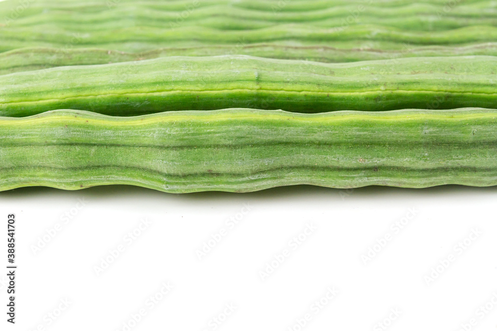 Fototapeta premium Sliced cut Moringa oleifera (drum stick) pods isolated on white background.