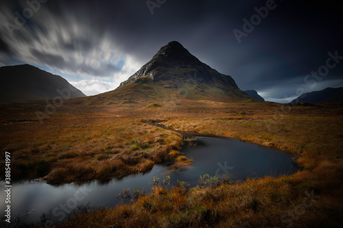 long exposure of the mountain named Bauchaille Etive Beag at lochan na fola in glencoe, highlands, scotland.