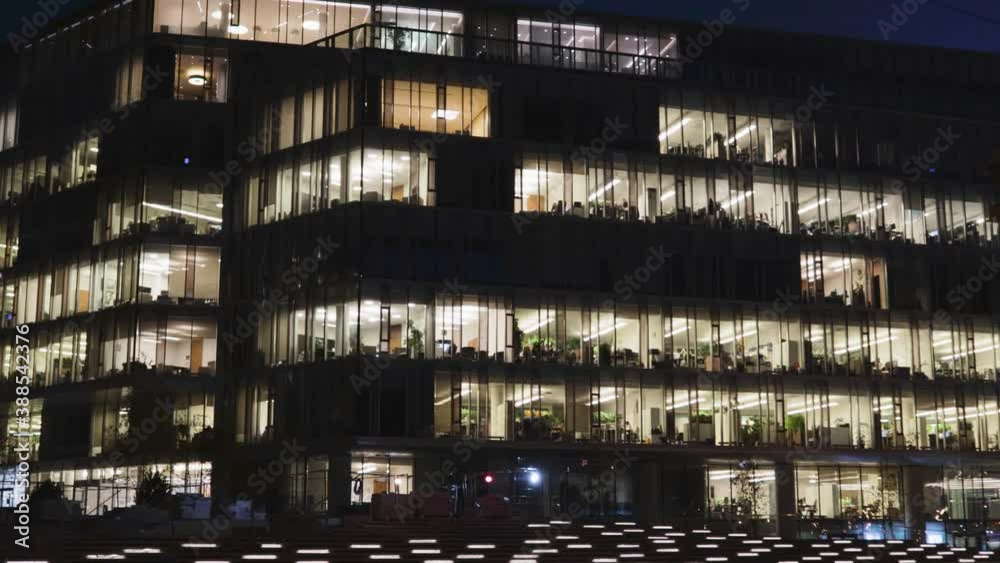 windows of an office building business financial at night overtime workaholic job windows of an office building business financial at night overtime workaholic job