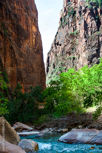 Utah's Zion canyon's soaring towers and monoliths have a quiet grandeur. The Virgin River has worn down the sandstone to create the amazing scenery.There is a path by the river to explore the park