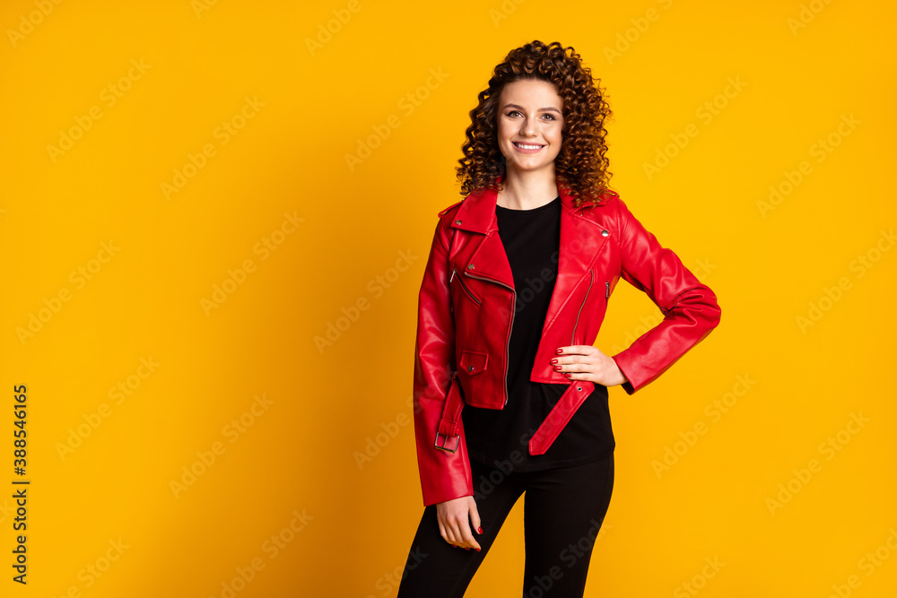 Fototapeta premium Portrait of her she nice charming cheerful cheery wavy-haired girl wear leather coat isolated over bright vivid shine yellow color background