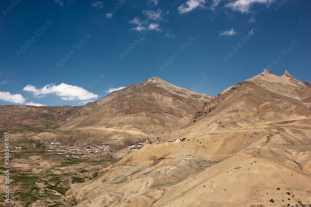 A village on the slopes of a Himalayan mountain in the Spiti valley A village on the slopes of a Himalayan mountain in the Spiti valley