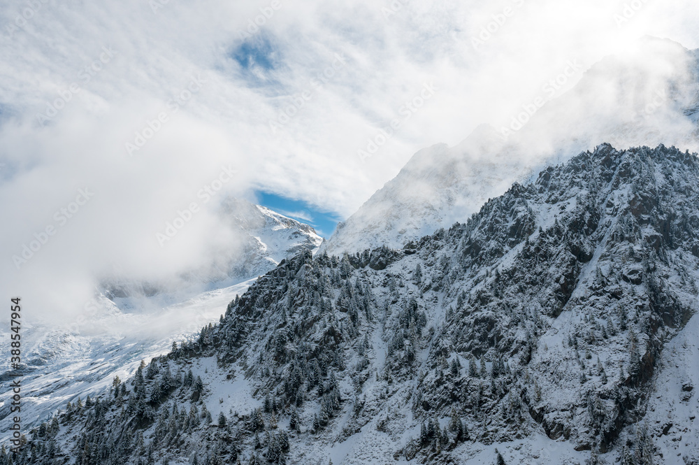 mistic winter landscape in first snow in Vallée du Trient, Valais