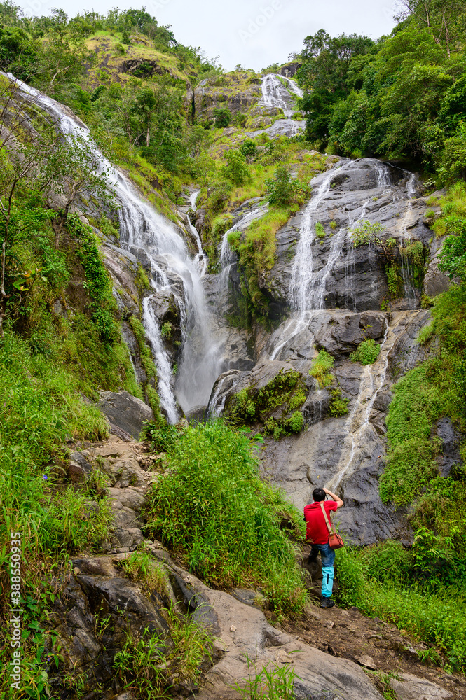 Petolosu, The highest waterfall with a standing hiker, the heart-shaped waterfall in Thailand at Umphang wildlife sanctuary, Tak province Petolosu, The highest waterfall with a standing hiker, the heart-shaped waterfall in Thailand at Umphang wildlife sanctuary, Tak province
