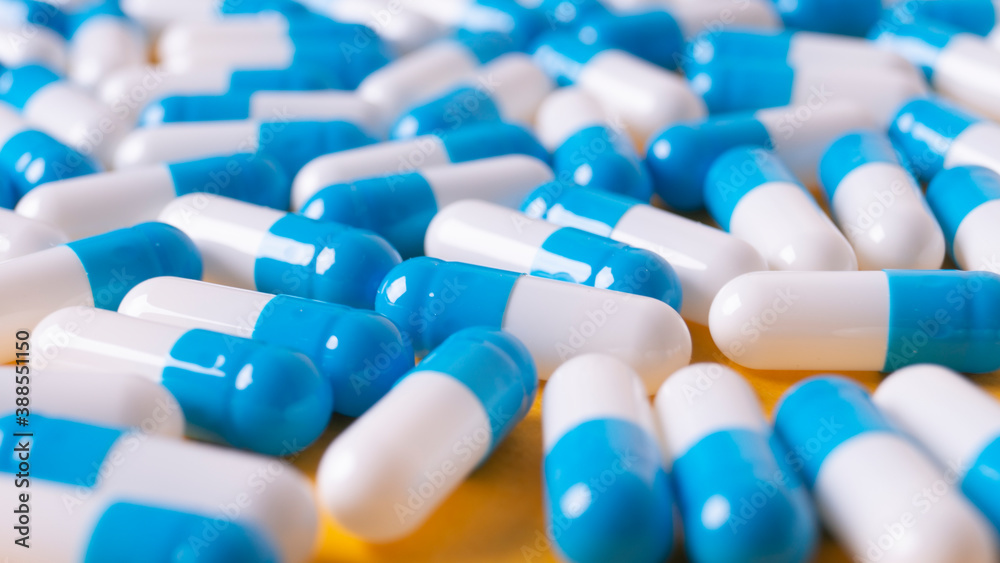 white and blue pills general background white and blue pills general background