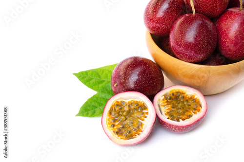 Passion fruit ( Maracuya ) in wooden bowl isolated on white background .