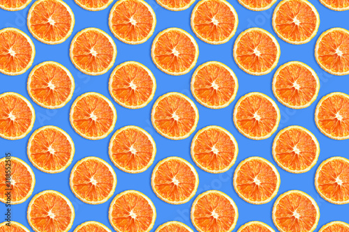 Dry orange slices background. Orange fruit cut texture. Citrus section pattern. Vibrant color summer design. Healthy fruit for immunological system backdrop. Christmas decoration and food ingredient.