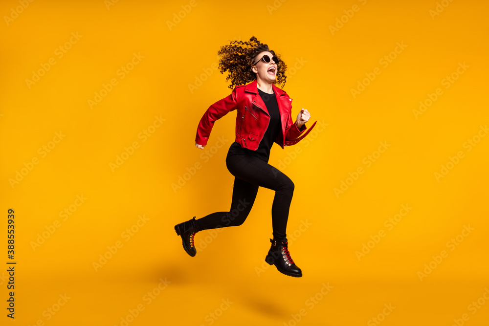 Full length body size view of pretty trendy active cheerful wavy-haired girl jumping running isolated on bright yellow color background