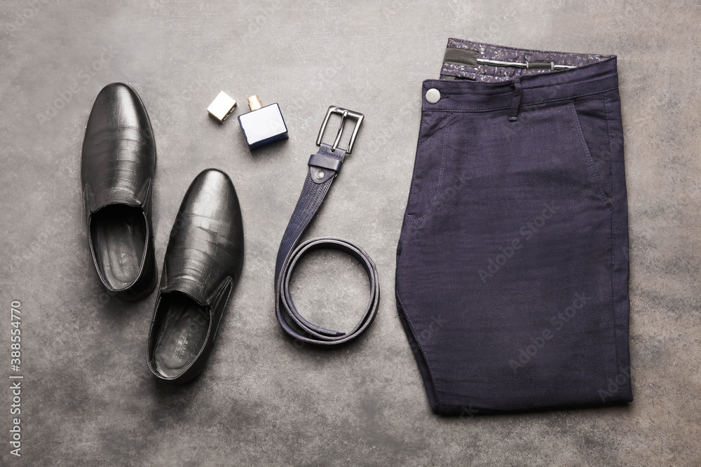 Classic blue men's trousers with black leather shoes and a belt Classic blue men's trousers with black leather shoes and a belt