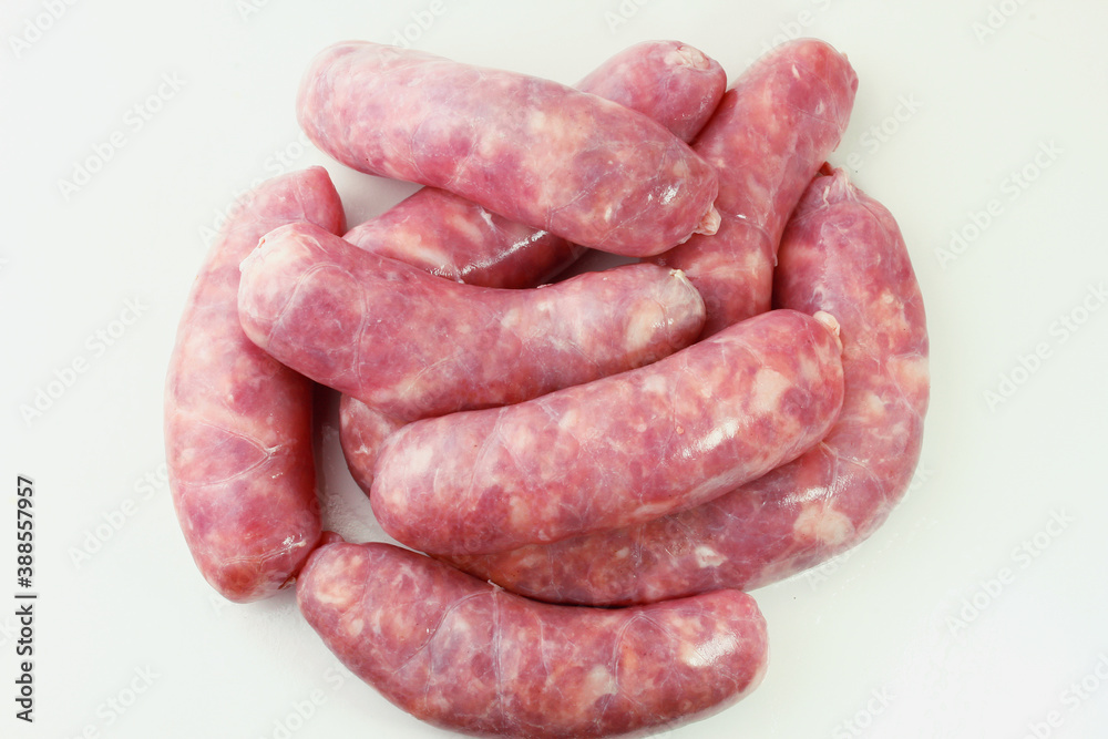 pile of fresh raw pork meat sausage isolated on white background pile of fresh raw pork meat sausage isolated on white background