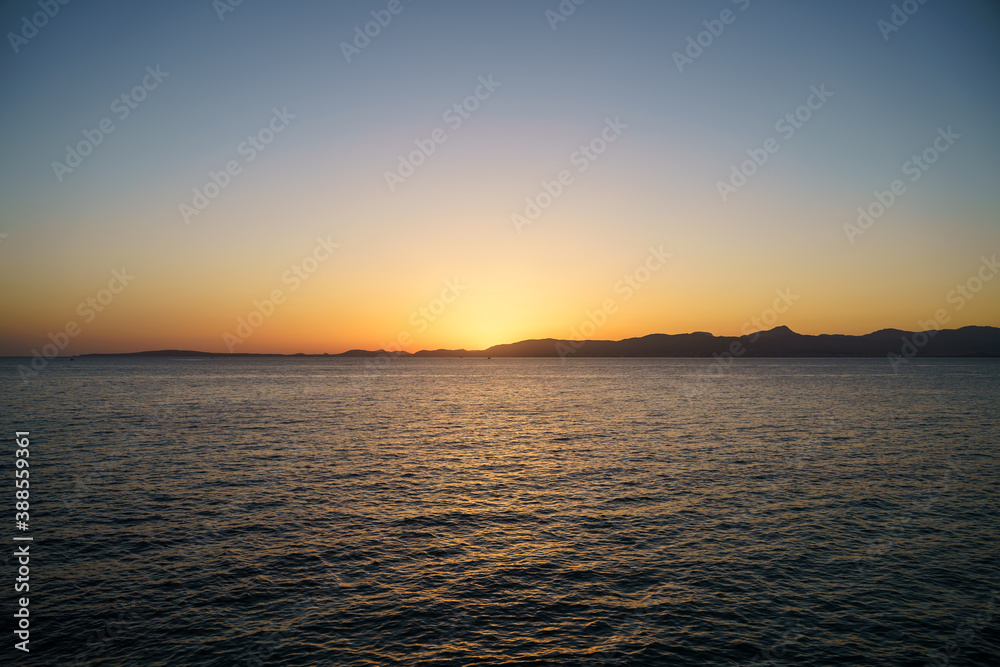 Beautiful orange sunset by the sea in Mallorca, Spain