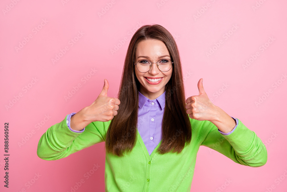 Portrait of positive cheerful girl show thumb up sign isolated over pastel color background Portrait of positive cheerful girl show thumb up sign isolated over pastel color background