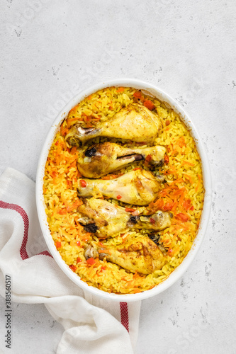 Chicken curry rice casserole in baking dish. Space for text, top view.