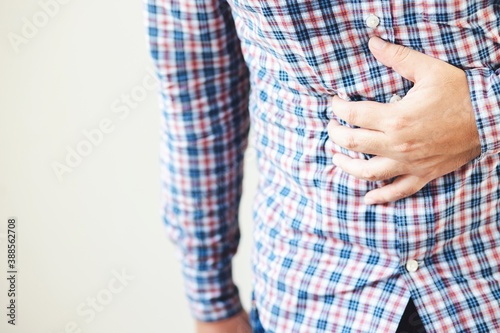 image of man use hands to catch the stomach.