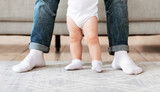Father And Little Baby Toddler Standing Together At Home, Cropped
