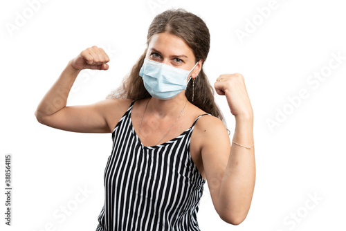 Happy woman celebrating success gesture wearing covid19 mask