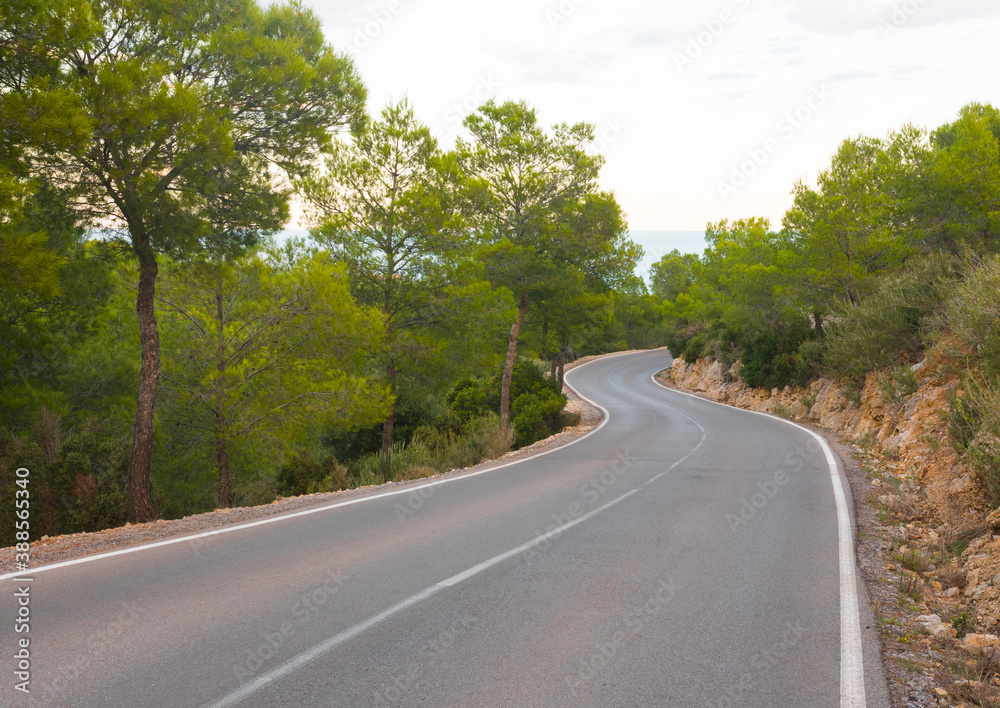 Road going down from the Santa Llucia chapel (Mirador, lookout point) in the Serra d'Irta natural park. Alcala de Xivert, Alcossebre, Valencian community, Spain. Road going down from the Santa Llucia chapel (Mirador, lookout point) in the Serra d'Irta natural park. Alcala de Xivert, Alcossebre, Valencian community, Spain.