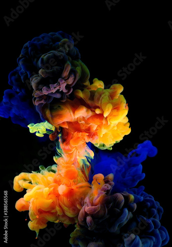 Color drops in water , abstract color mix , drop of Ink color mix paint falling on background, 