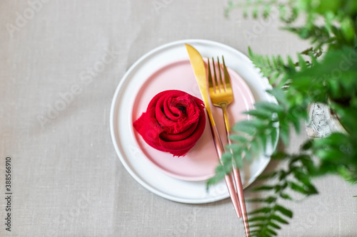 Valentine s Day table setting with linen napkins  fork  knife. The concept of using environmentally friendly natural materials.