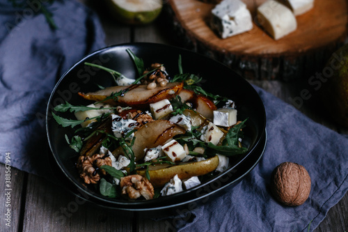 salad with pear nuts arugula and cheese