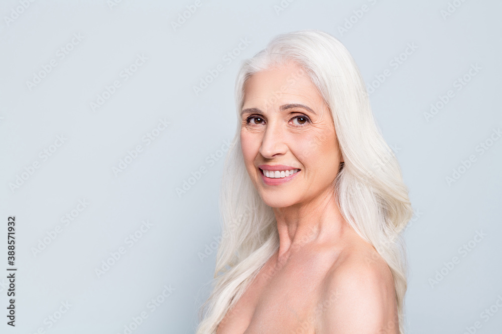 Close-up profile side view portrait of nice attractive cheery grey-haired elderly lady healthcare pure skin isolated on gray pastel color background Close-up profile side view portrait of nice attractive cheery grey-haired elderly lady healthcare pure skin isolated on gray pastel color background