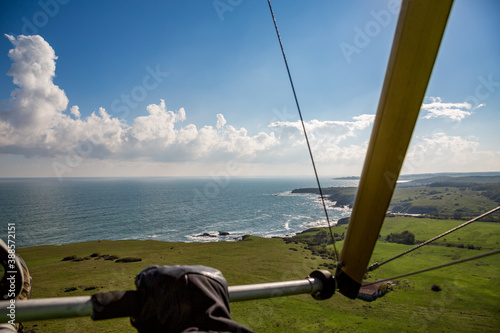 Tandem motor paragliding over Black Sea shores near town of Ahtopol. Sunny autumn day, scenery colors and amazing landscapes and seascapes, Bulgaria photo