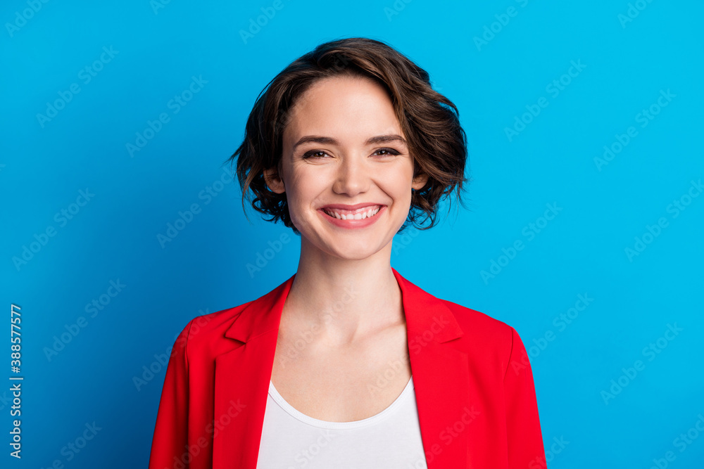 Close-up portrait of lovely cheerful content brown-haired lady agent broker isolated over bright blue color background Close-up portrait of lovely cheerful content brown-haired lady agent broker isolated over bright blue color background