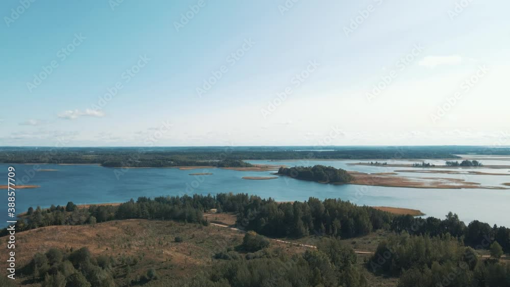 Drone shooting. Top view of lake Drivyaty in the Braslav lakes National Park, the most beautiful lakes in Belarus. An island in the lake. Drone shooting. Top view of lake Drivyaty in the Braslav lakes National Park, the most beautiful lakes in Belarus. An island in the lake.