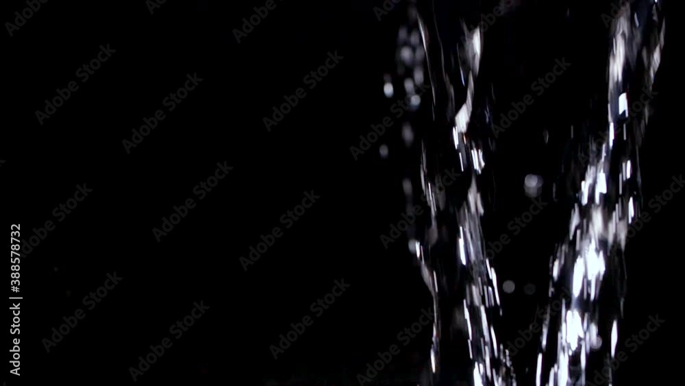 Stream of Clear Water pouring into black background in slow motion 240p Stream of Clear Water pouring into black background in slow motion 240p