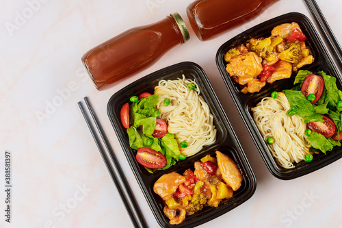 Chinese food in plastic container. Food delivery concept.