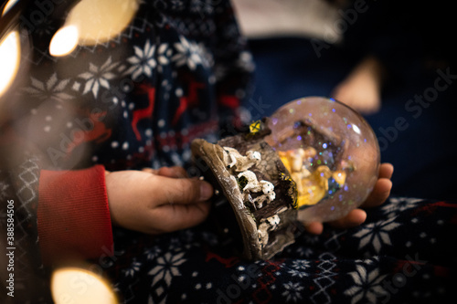 Christmas childhood boy dreams of evening Christmas tree holiday flashlights