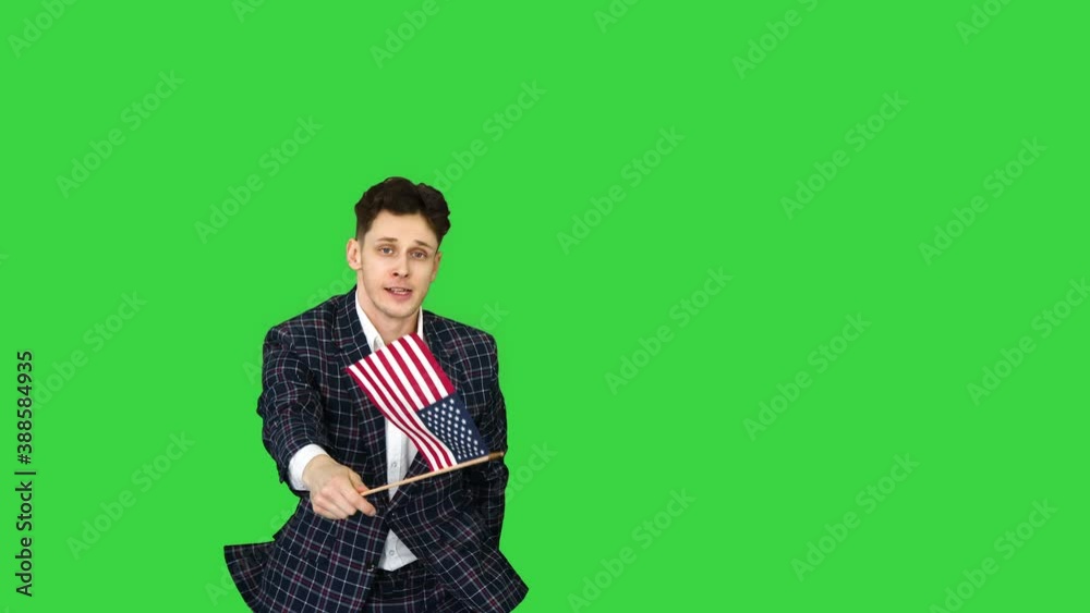 Cool man in suit does crazy dancing with American flag on a Green Screen, Chroma Key. Cool man in suit does crazy dancing with American flag on a Green Screen, Chroma Key.